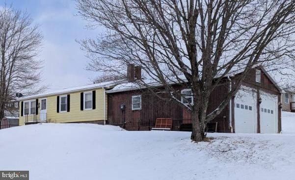 ranch-style home featuring a chimney