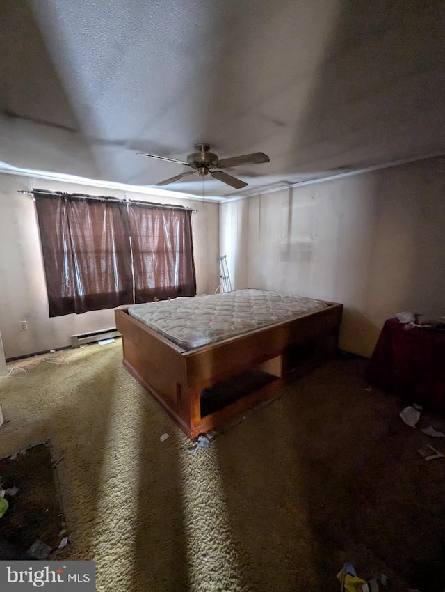 playroom with carpet floors, a baseboard radiator, and ceiling fan