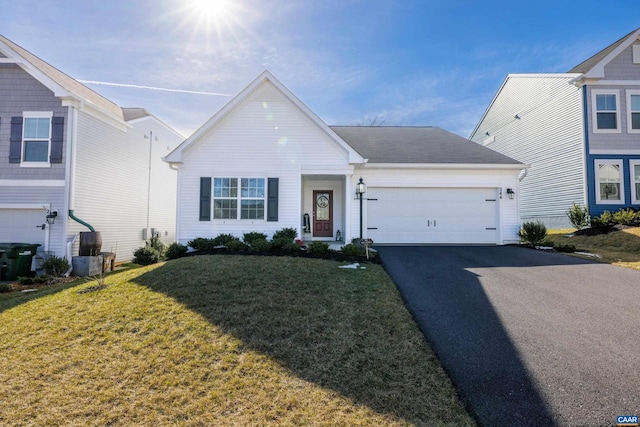 view of front of house featuring a garage, a front yard, and driveway