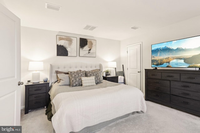 bedroom with light carpet and visible vents