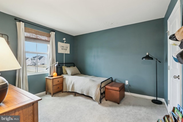 bedroom with carpet and baseboards