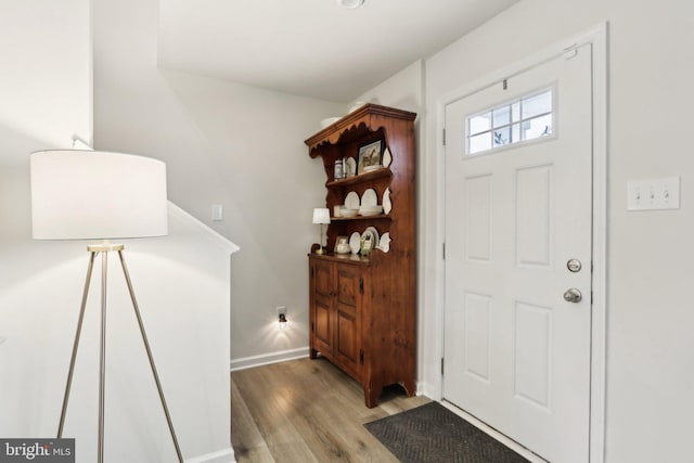 entrance foyer with light wood-style flooring and baseboards