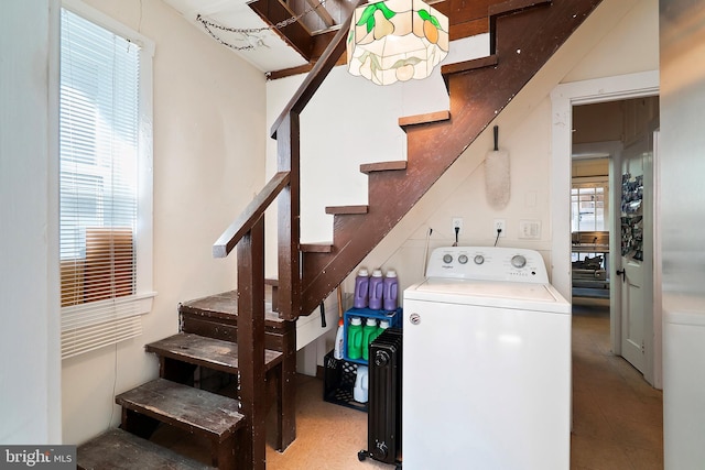 laundry room featuring laundry area, washer / clothes dryer, and plenty of natural light