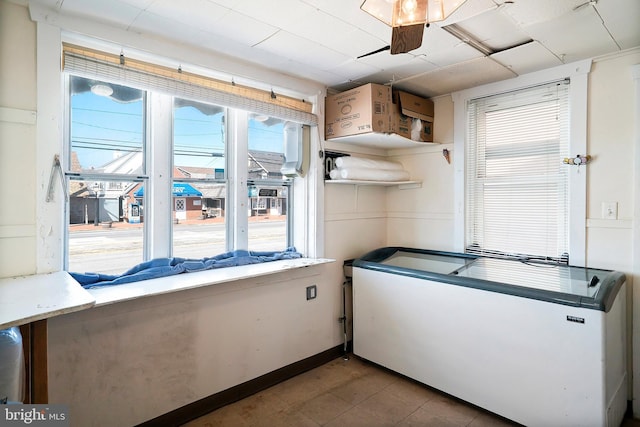 kitchen featuring open shelves and a ceiling fan