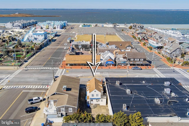 birds eye view of property featuring a water view