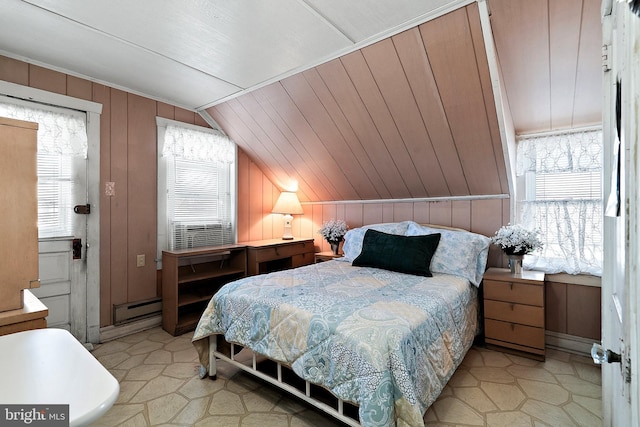 bedroom with a baseboard heating unit, vaulted ceiling, wooden walls, and multiple windows