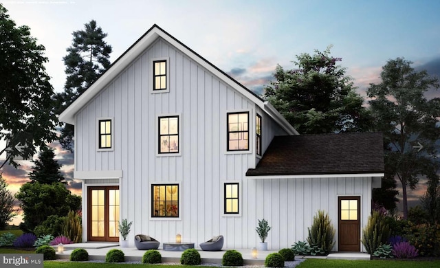 exterior space with a shingled roof and board and batten siding