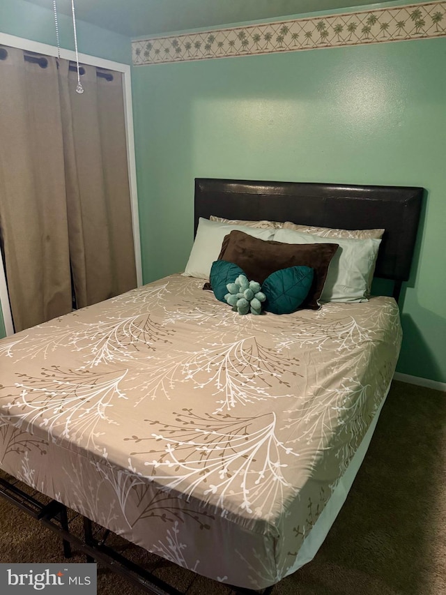 carpeted bedroom with baseboards