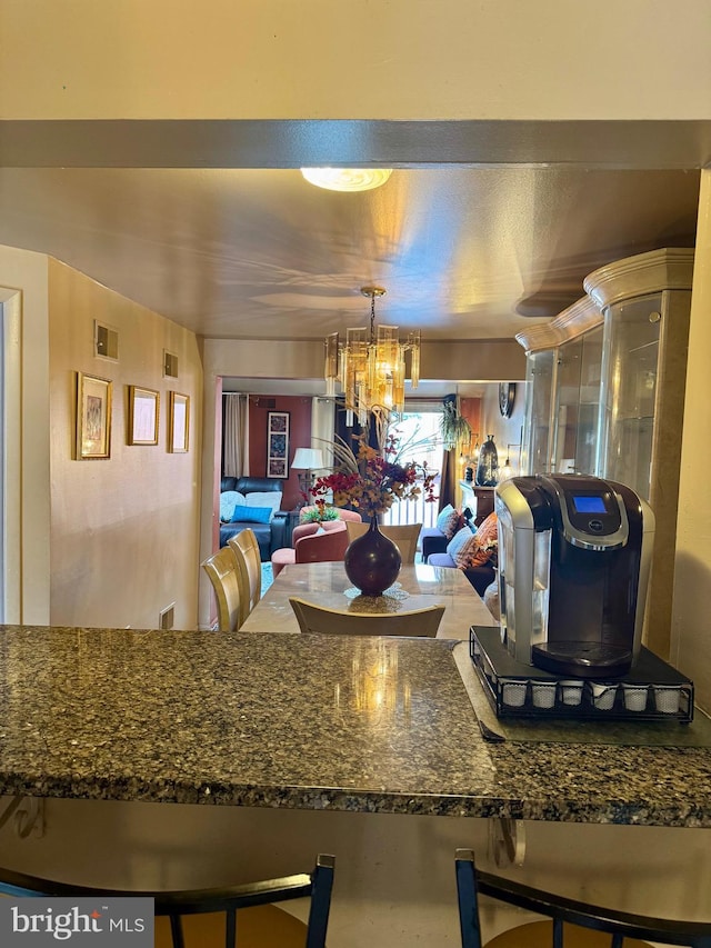 kitchen featuring visible vents and a notable chandelier