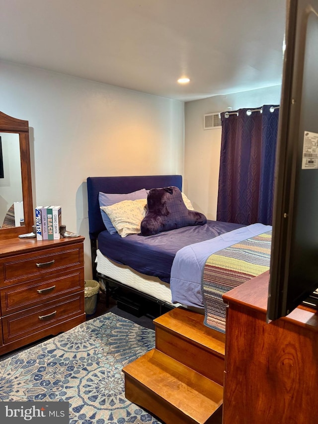 bedroom featuring visible vents