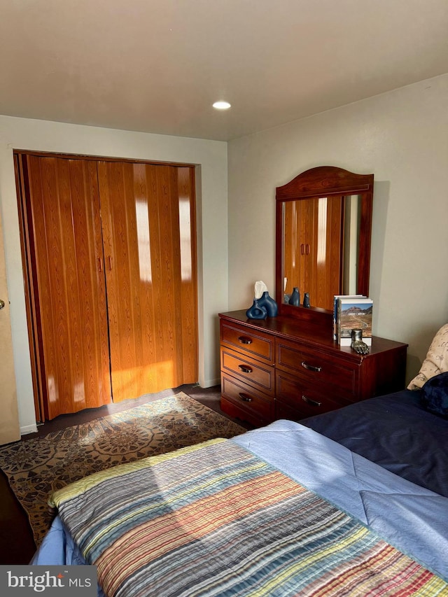 bedroom featuring recessed lighting and dark carpet