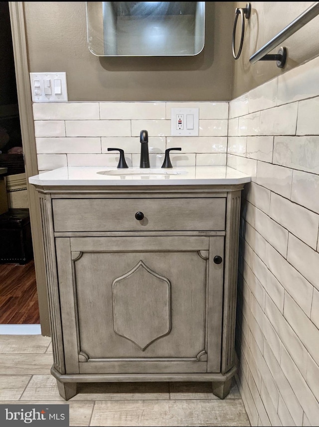 bathroom featuring wood finished floors and vanity