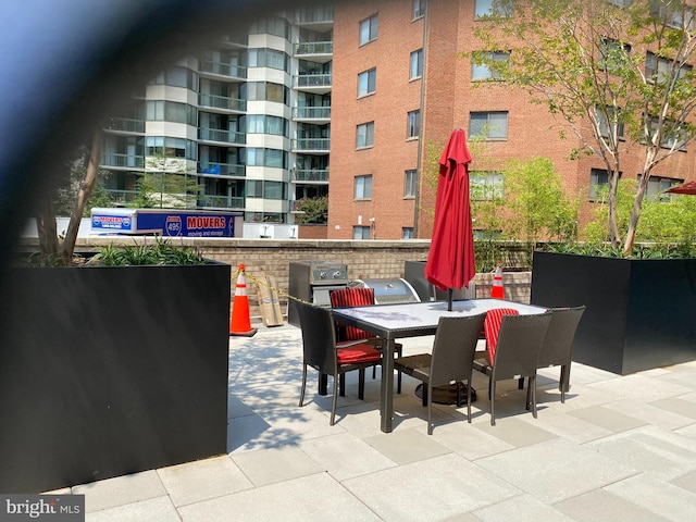 view of patio / terrace with grilling area and outdoor dining space