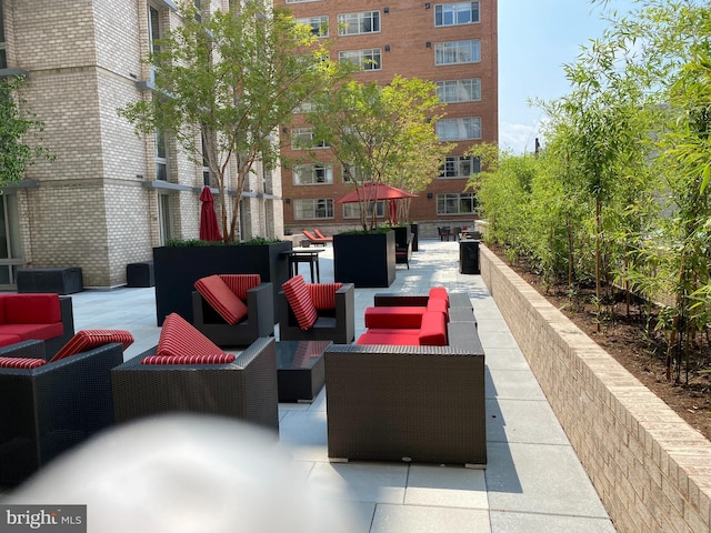 view of community with outdoor lounge area and a patio