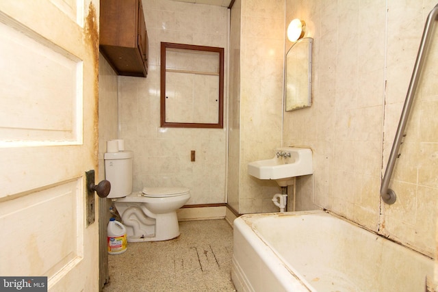 full bath with tile walls, toilet, and a bath