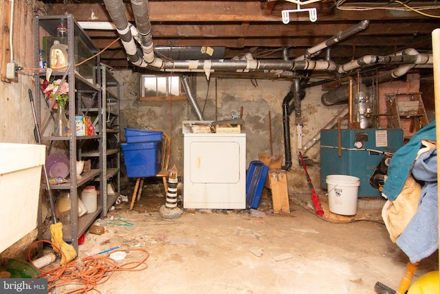 unfinished basement with washer / clothes dryer