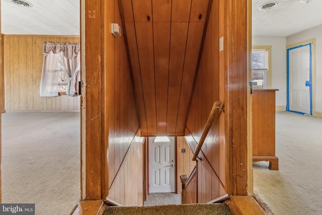 stairway with carpet floors, visible vents, and plenty of natural light