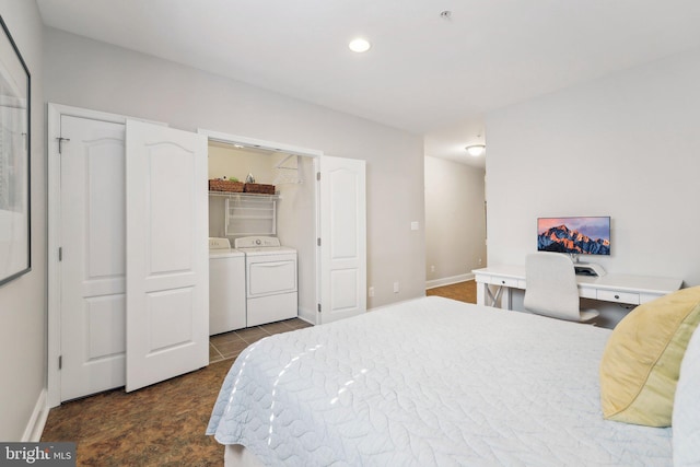 bedroom featuring independent washer and dryer and baseboards