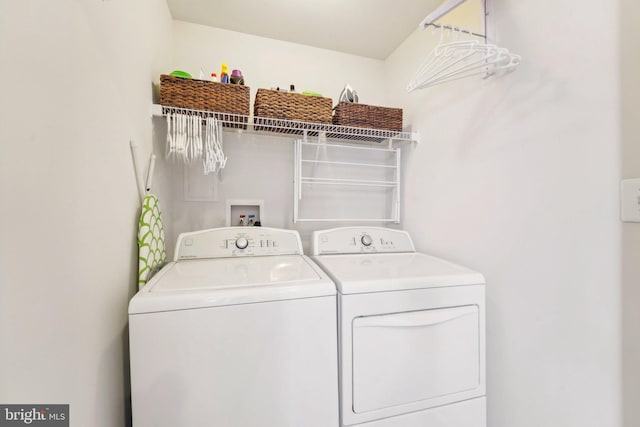 laundry area with laundry area and separate washer and dryer