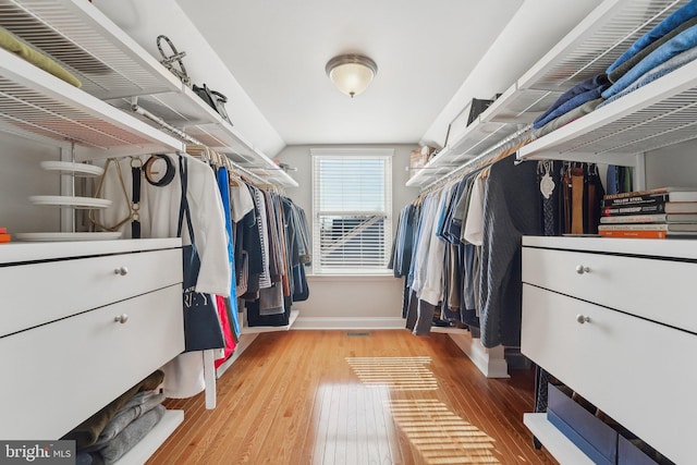 spacious closet featuring light wood-style floors and visible vents