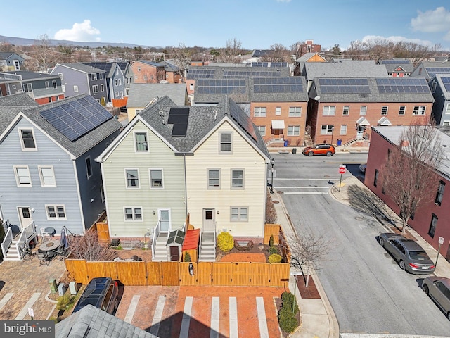 birds eye view of property with a residential view