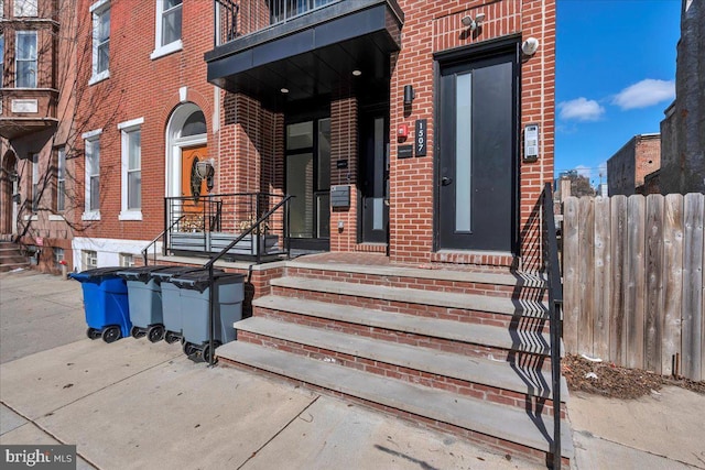 entrance to property with brick siding