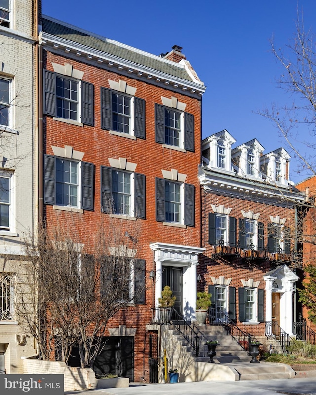 view of front of home featuring brick siding