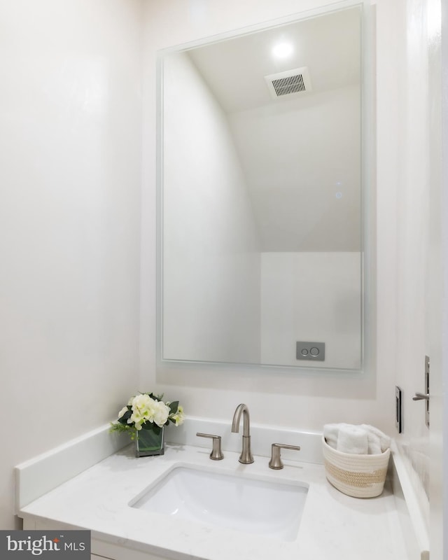 bathroom with vanity and visible vents