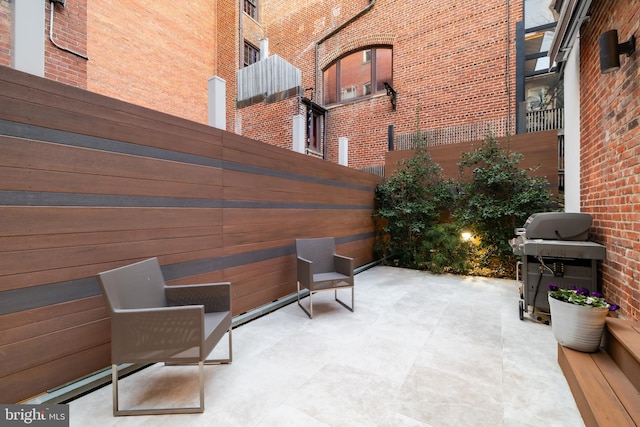 view of patio featuring a grill