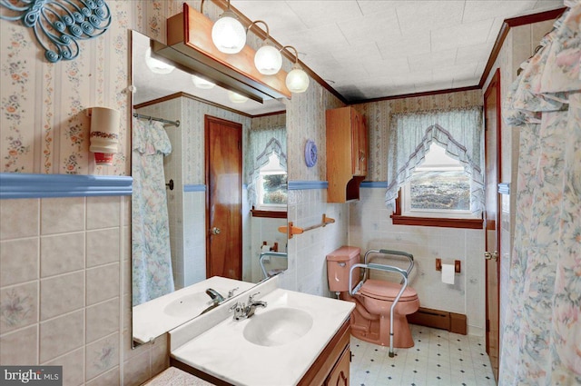 bathroom with wallpapered walls, baseboard heating, ornamental molding, wainscoting, and tile patterned floors