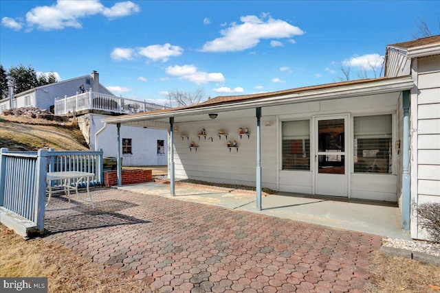 back of property featuring a patio