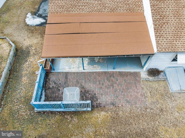 details with a shingled roof and a bulkhead entry