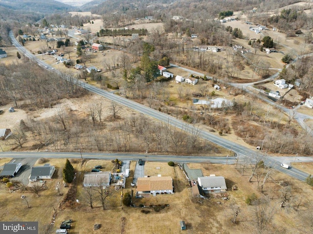 birds eye view of property featuring a mountain view and a rural view