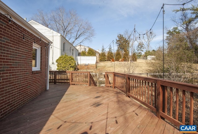 wooden deck featuring fence