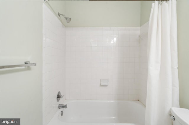 full bathroom with shower / tub combo and toilet