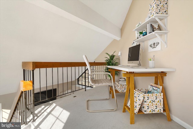 carpeted office space featuring vaulted ceiling with beams and baseboards