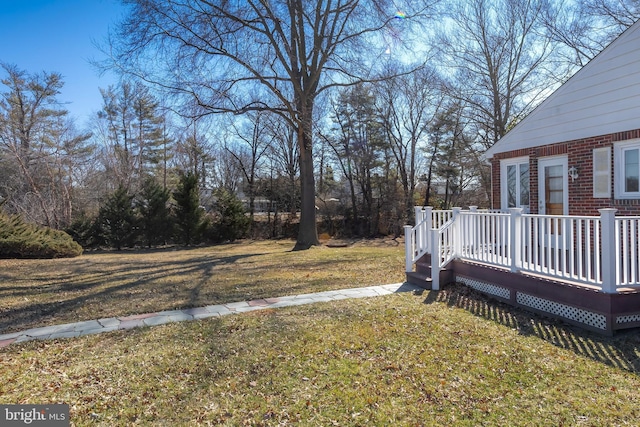 view of yard with a deck