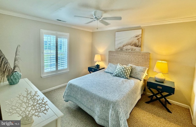 carpeted bedroom with baseboards, visible vents, a ceiling fan, and ornamental molding