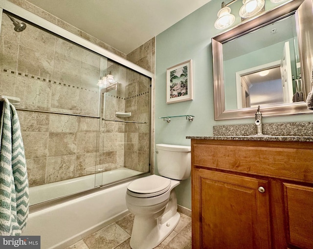 bathroom featuring toilet, enclosed tub / shower combo, and vanity