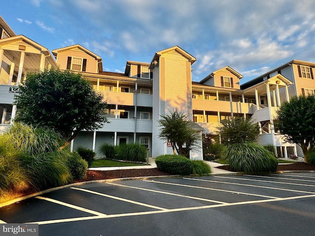 view of property featuring uncovered parking