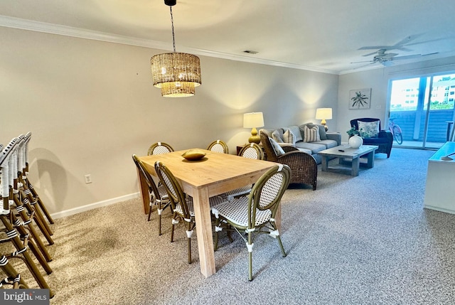 dining space with light carpet, visible vents, baseboards, crown molding, and ceiling fan with notable chandelier