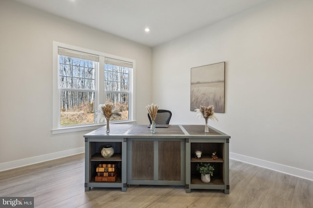 bar featuring light wood-style floors, baseboards, and recessed lighting