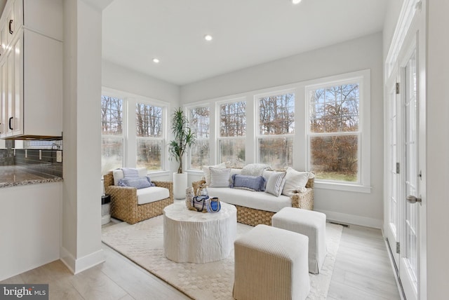 sunroom featuring a healthy amount of sunlight and visible vents