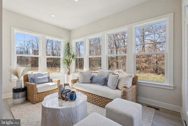 sunroom / solarium with a wealth of natural light and visible vents