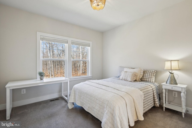 bedroom featuring baseboards, visible vents, and carpet flooring