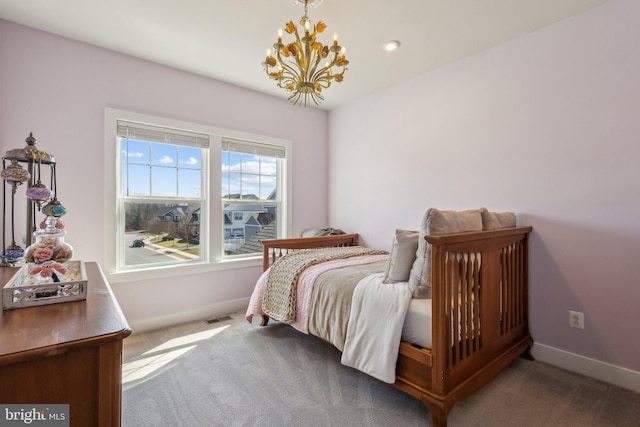 bedroom featuring carpet floors, visible vents, baseboards, and a notable chandelier