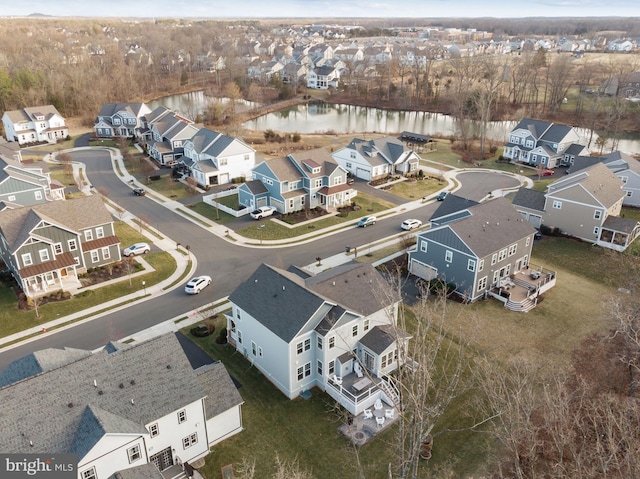 birds eye view of property featuring a water view and a residential view