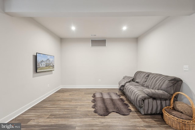 sitting room with recessed lighting, wood finished floors, visible vents, and baseboards