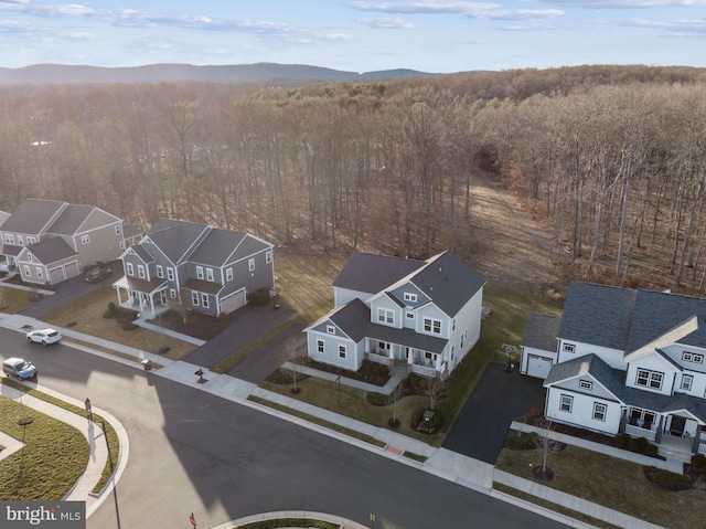 bird's eye view with a residential view and a wooded view