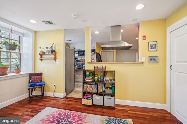 interior space featuring wood finished floors, visible vents, and recessed lighting